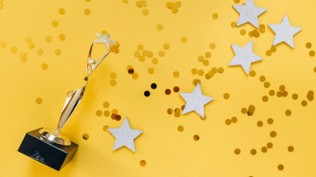 wevo yellow award with stars and confetti